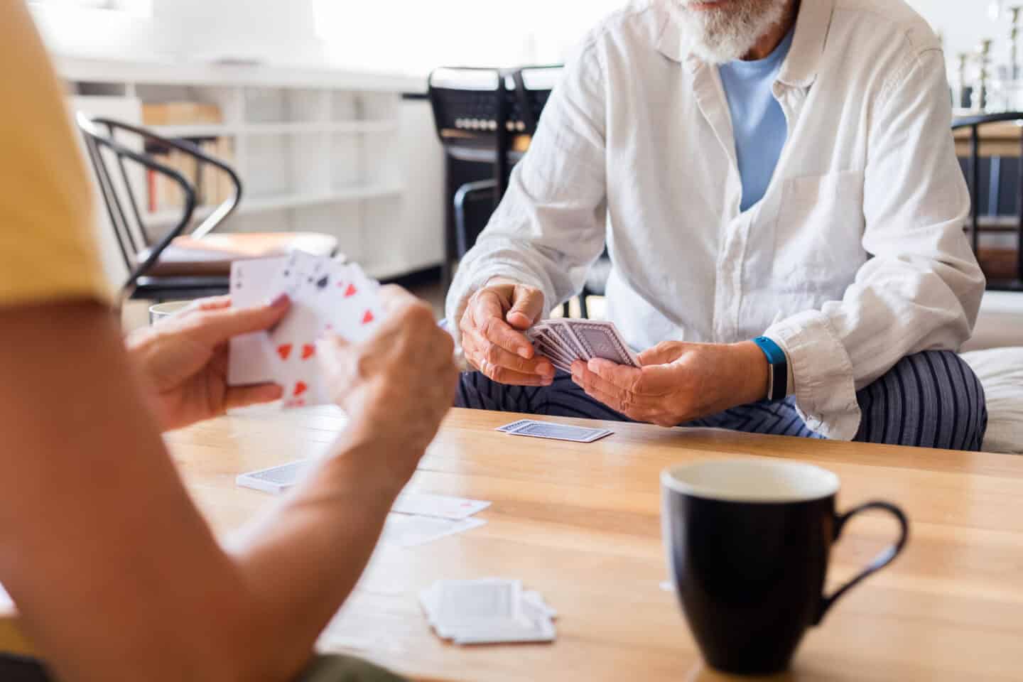 elderly seniors playing cards