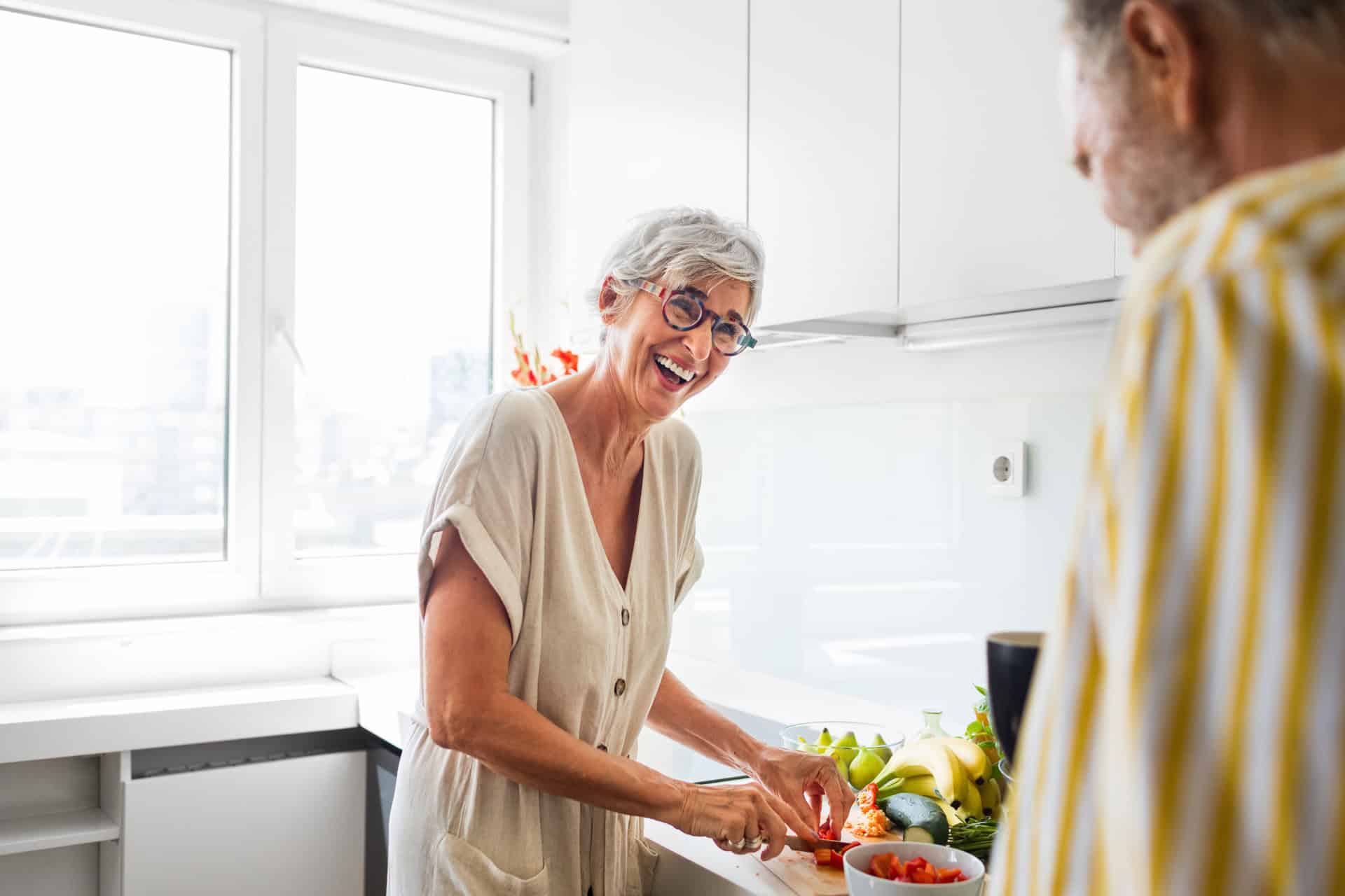 elderly woman chopping kitchen